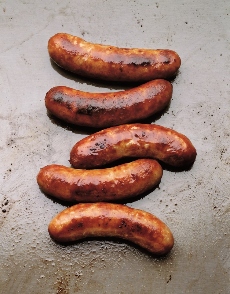 cooked sausages in row