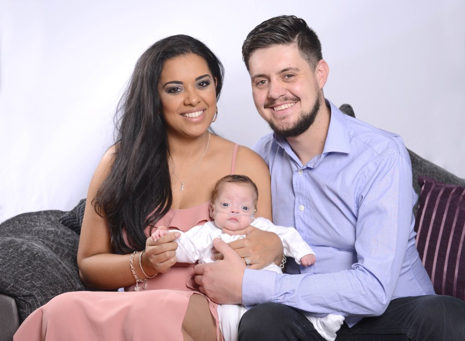  Happy family . . . Mike Naama with wife Roxanne Cooper and baby Jaxon at home