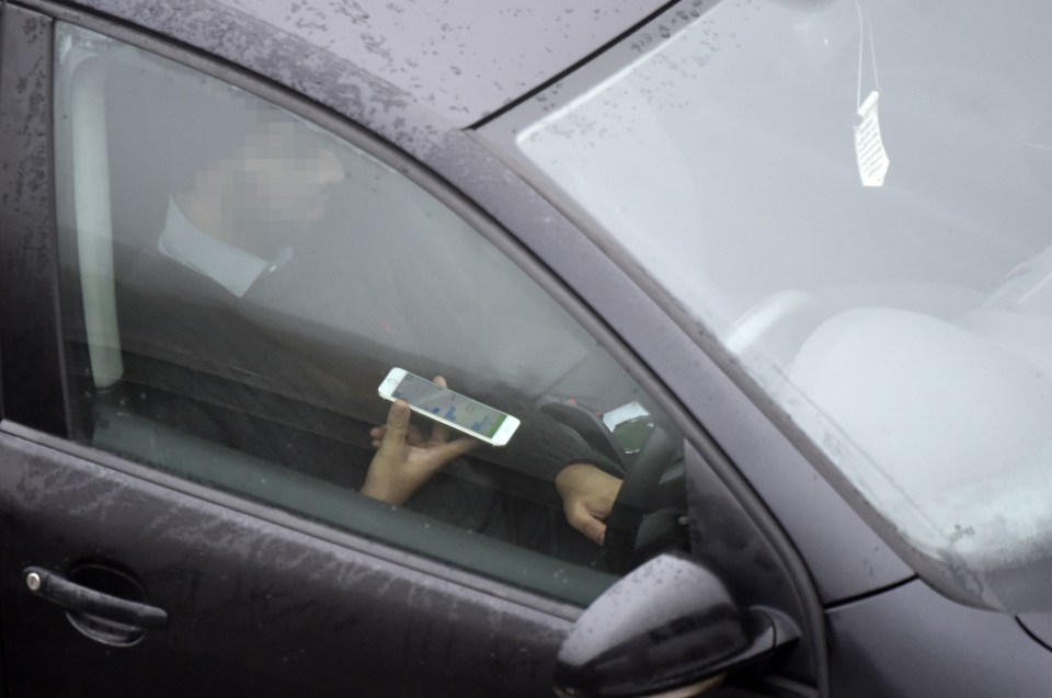  Another holds his phone on the M1