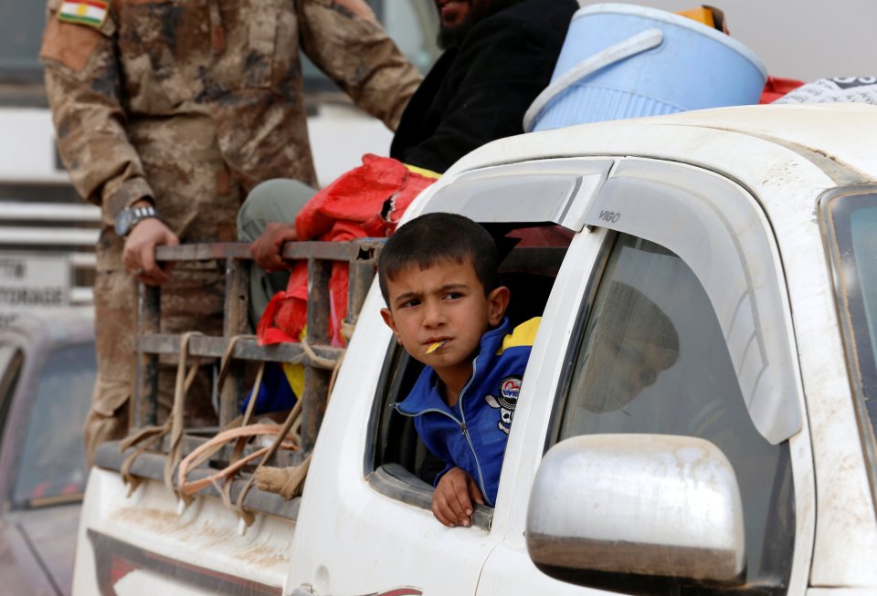 A displaced Iraqi boy is pictured after escaping from Islamic State controlled village of Abu Jarboa