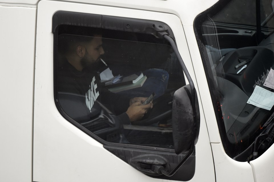  This motorist checks his phone and takes his eyes off the road