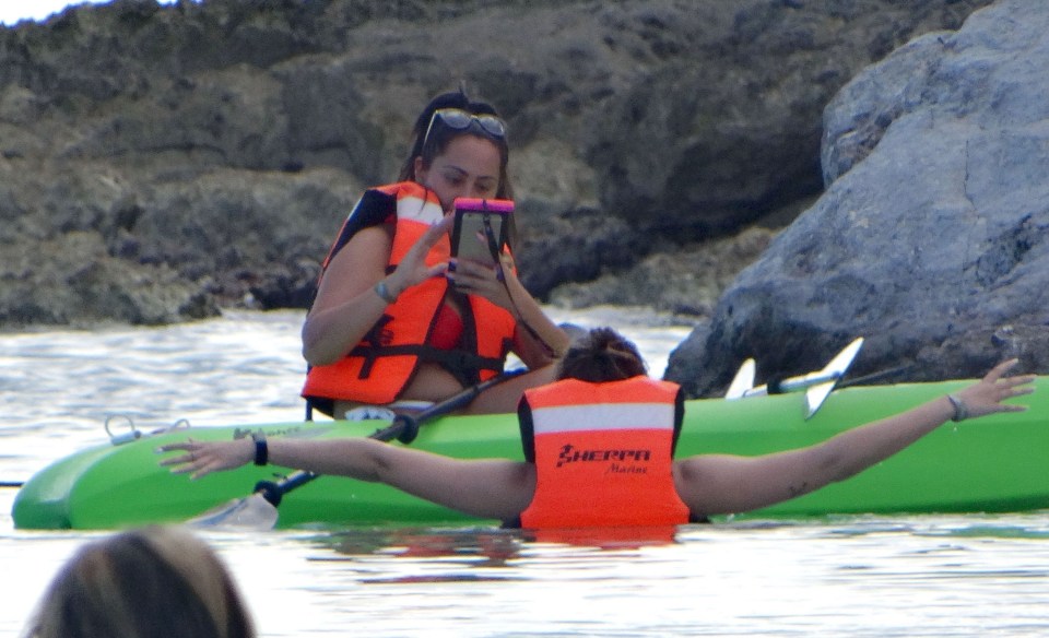 After doing her share of the rowing, Sophie turns photographer for Charlotte 