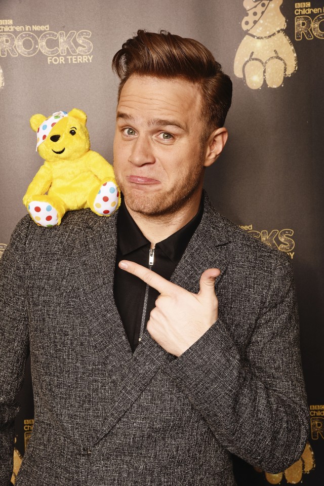  Before he went on stage, Olly got into the spirit by larking around with the charity's mascot