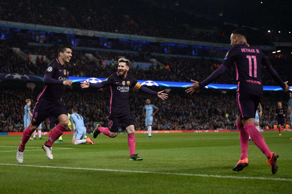 Barcelona's Argentinian striker Lionel Messi (C) celebrates scoring his team's first goal with Barcelona's Uruguayan striker Luis Suarez (L) and Barcelona's Brazilian striker Neymar during the UEFA Champions League group C football match between Manchester City and Barcelona at the Etihad Stadium in Manchester, north west England on November 1, 2016. / AFP PHOTO / OLI SCARFFOLI SCARFF/AFP/Getty Images