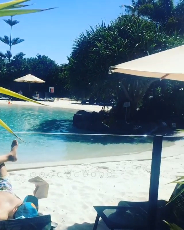 Vicky shared a video from her seat beside the hotel pool