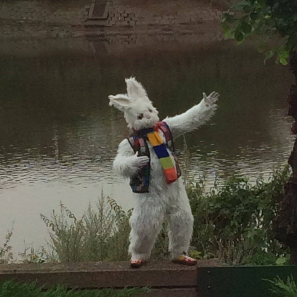  The rabbit waves and cavorts for people as they drive by the bridge over the Thames in west London