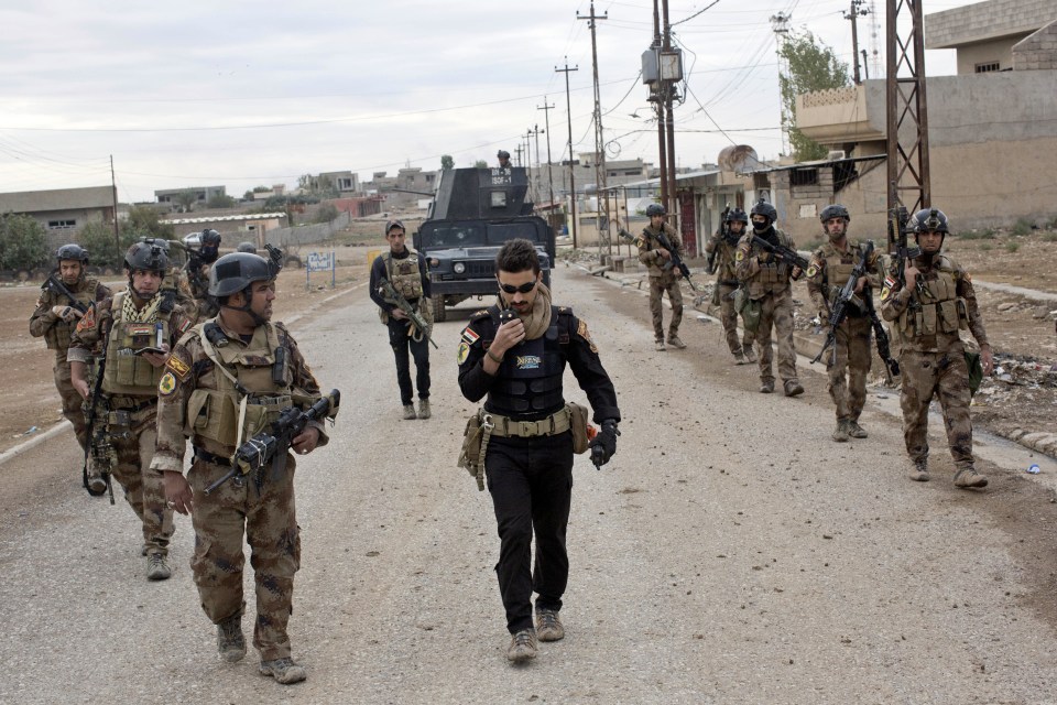  Iraqi special forces soldiers patrol a street in Gogjali, an eastern district of Mosul captured from ISIS this week