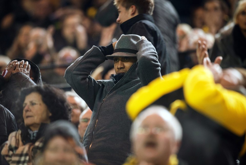  Pierre-Emerick Aubameyang sits with his head in his hands in the stands last night