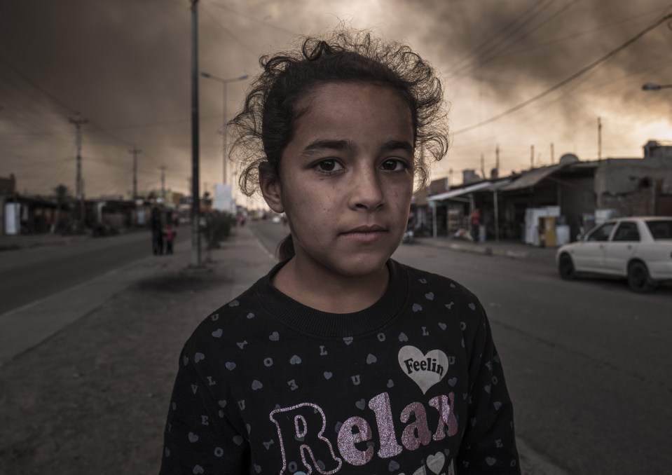  A child in Al Qayyarah, a town on the outskirts of Mosul that ISIS fled in desperation