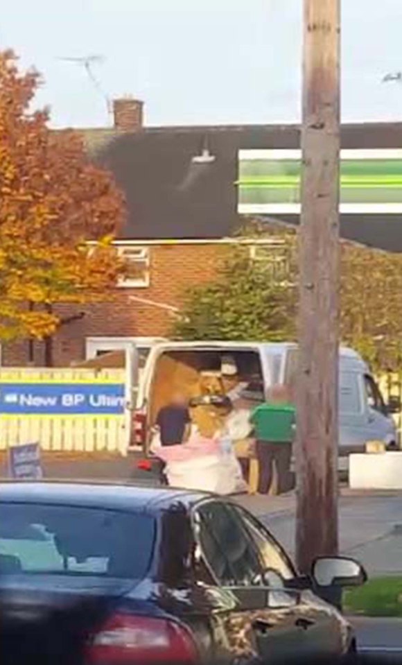 DELIVERY DRIVER CHUCKS PARCELS OVER FENCE