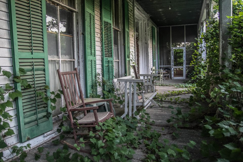 The garden has overgrown onto the porch