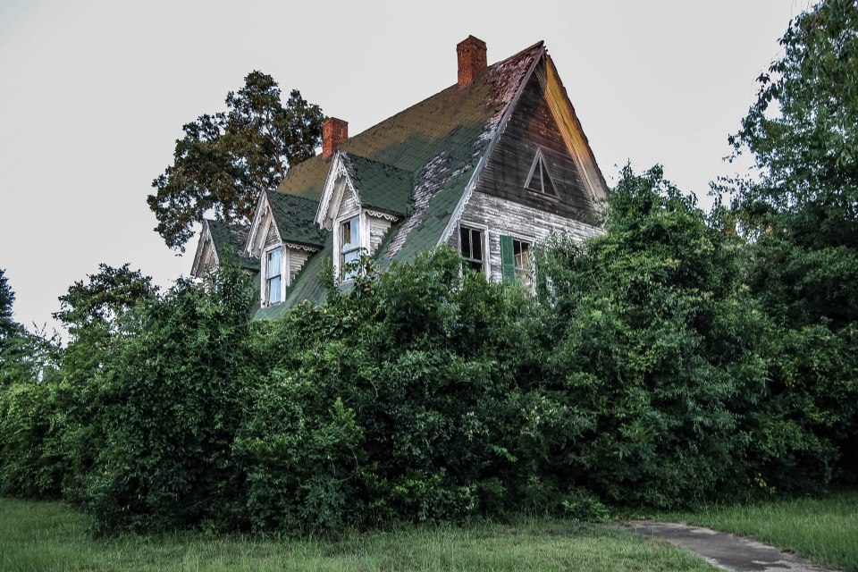 The outside of the house is in a state of disrepair 