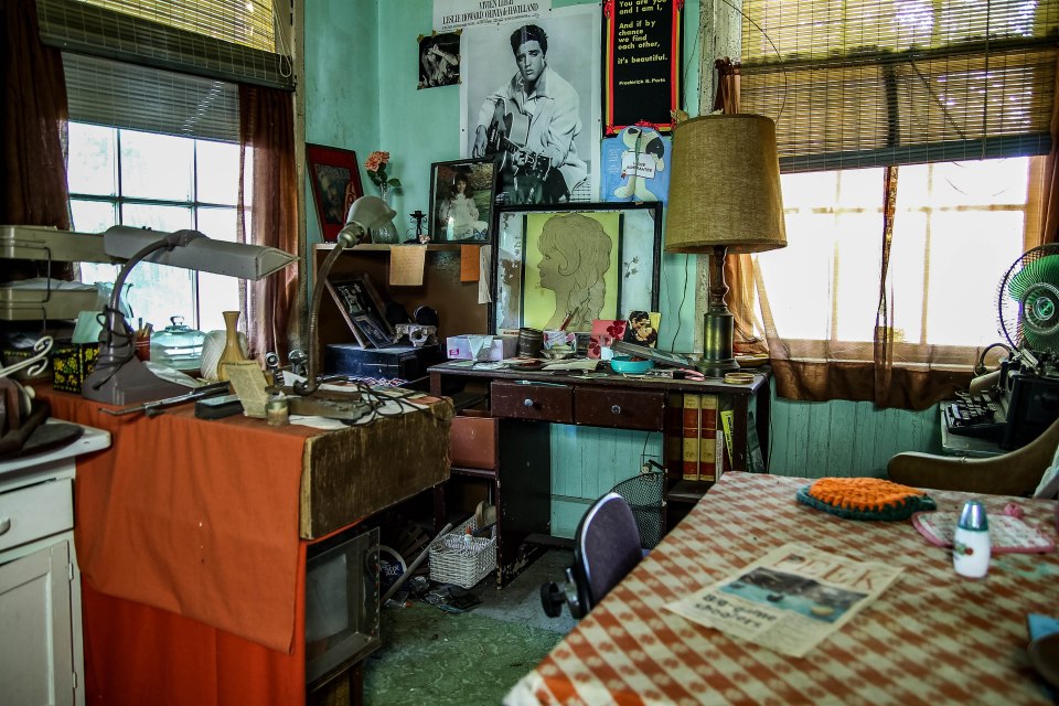 A poster of Elvis hangs on the wall, just as the owners left it when they abandoned the house