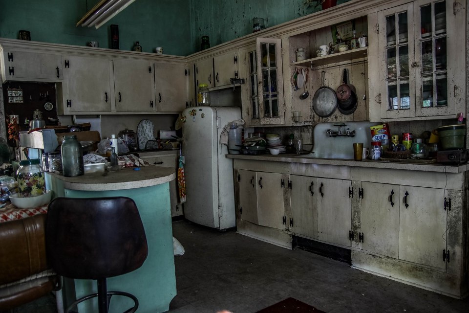 The kitchen is fully stocked, as if ready for someone to move in