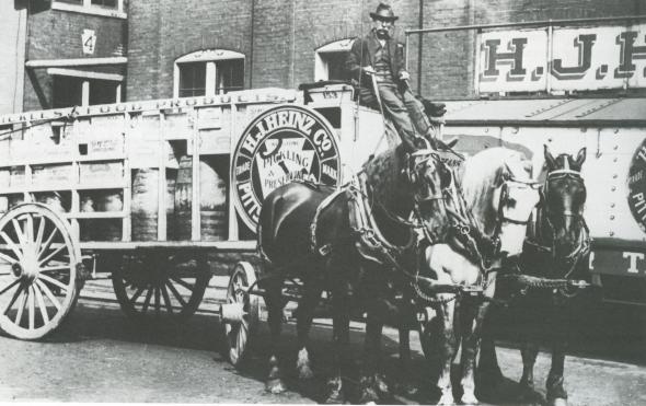  Before cars came about, a horse and cart was used to distribute the product