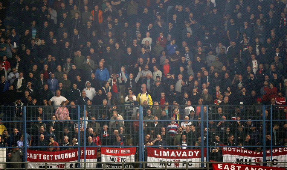 Manchester United fans cheer the team on during the UEFA Europa League match at Fenerbahce