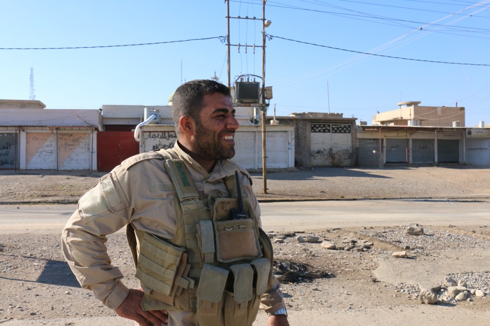  A soldier relaxes after wresting control of the suburb from ISIS