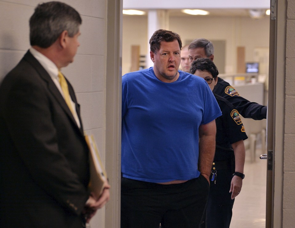 Todd Kohlhepp is escorted into a Spartanburg County magistrate courtroom after being charged with kidnapping