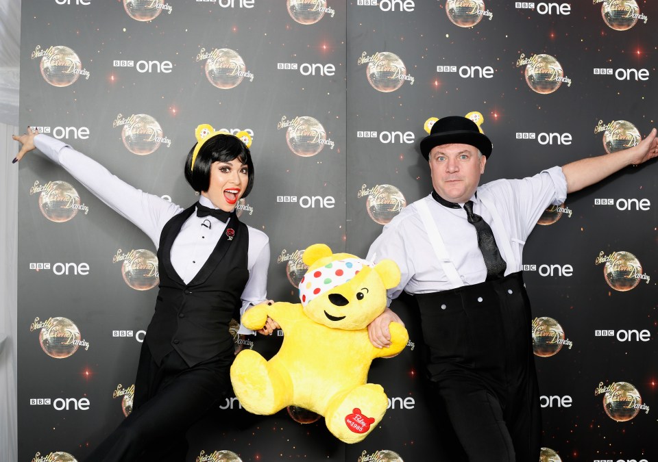  Katya Jones and Ed Balls posed up with the iconic bear