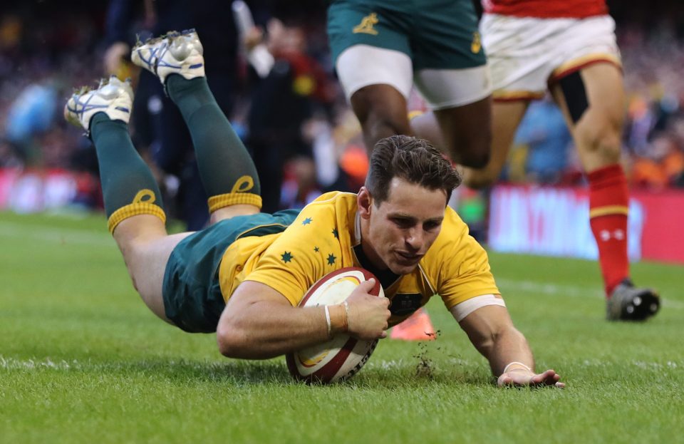 Bernard Foley of Australia dives over to score his team's fourth try