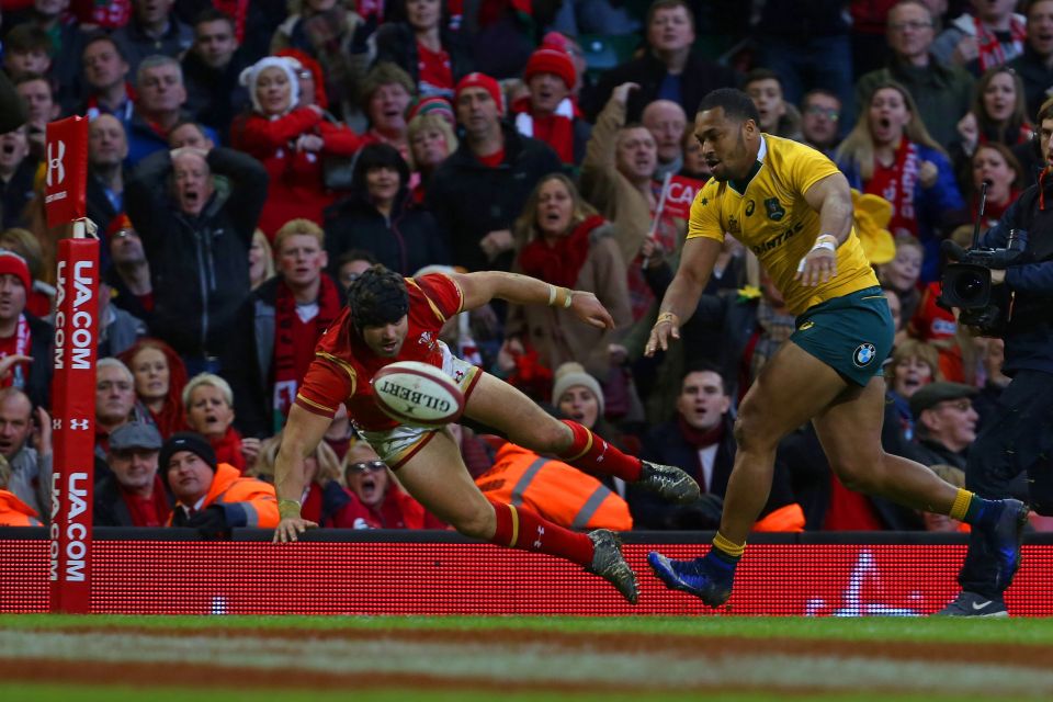 Wales' full-back Leigh Halfpenny drops the ball close to the try line 