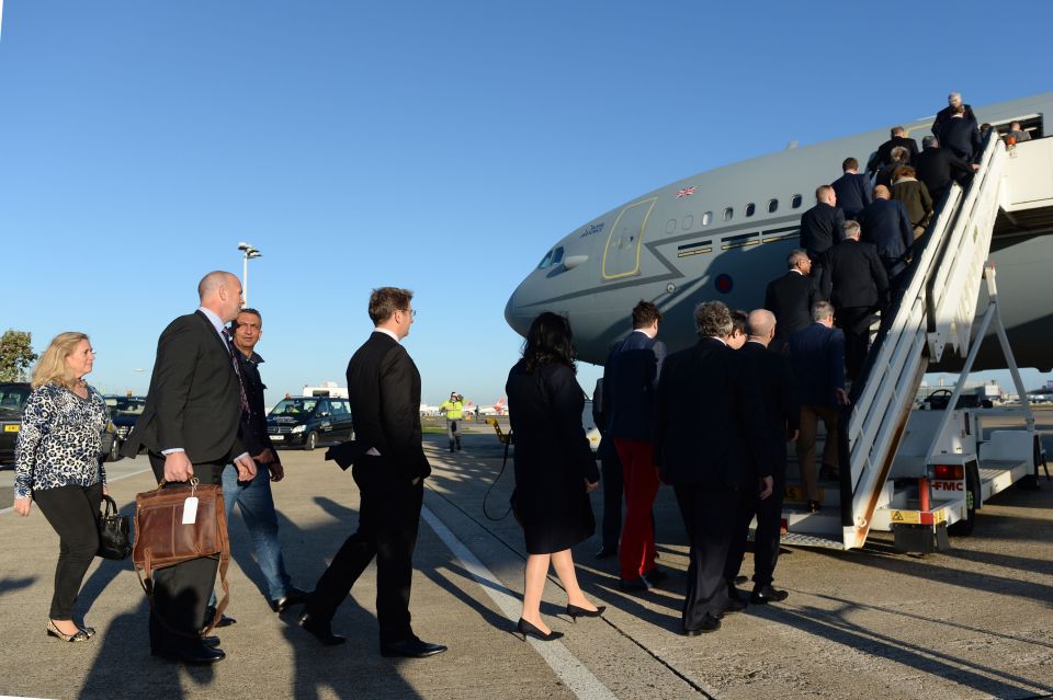  Theresa May boarding the plane at Heathrow airport on her way to Delhi