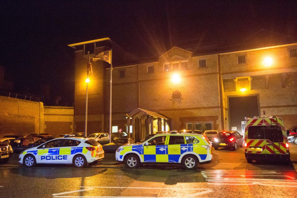 Dozens of police cars surrounded the prison in Bedfordshire as the riot continuted inside