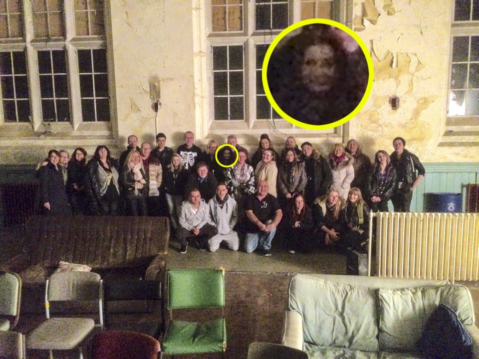 GHOST HUNTER CAPTURES PHOTOBOMBING PHANTOM ON CAMERA DURING TEAM PHOTO LINE-UP AT SPOOKY ABANDONED HOSPITAL