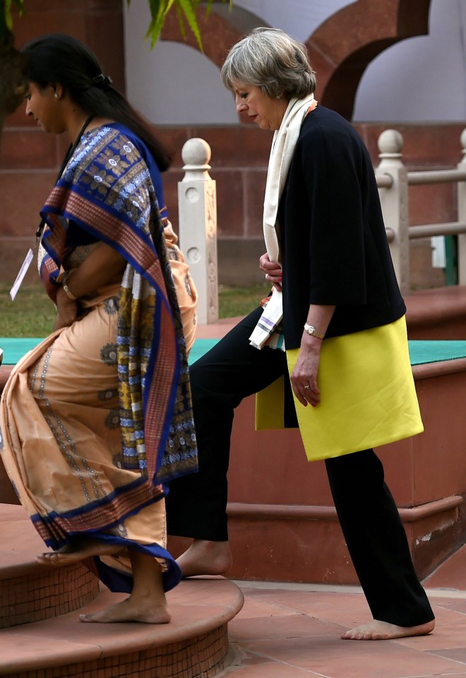  Time to toe the line . . . shoeless Theresa May makes barefoot tribute to Mahatma Gandhi