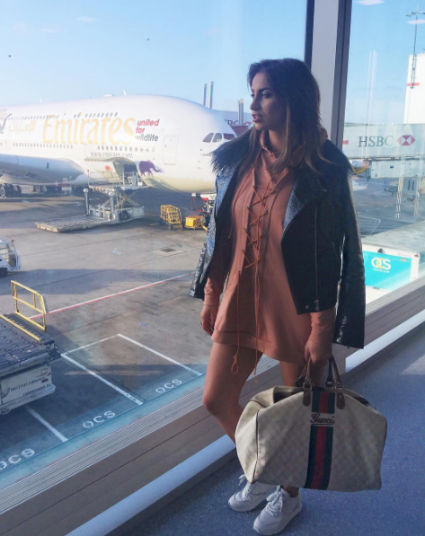  She previously added a snap of herself at the airport as she began her holiday