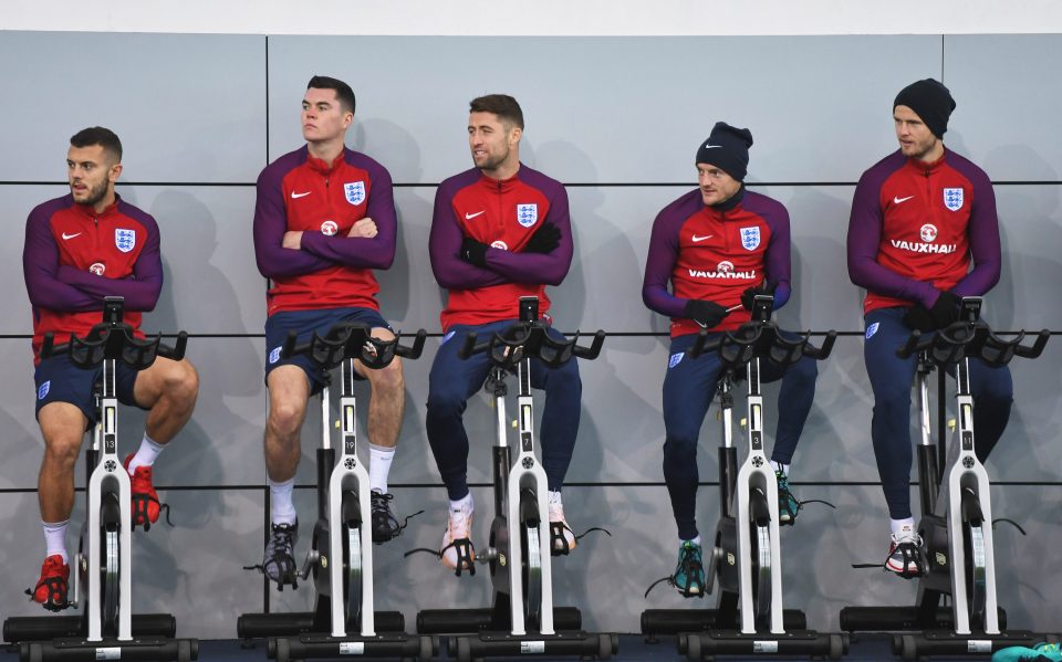 Jack Wilshere along with his teammates are seen on exercise bikes during England training