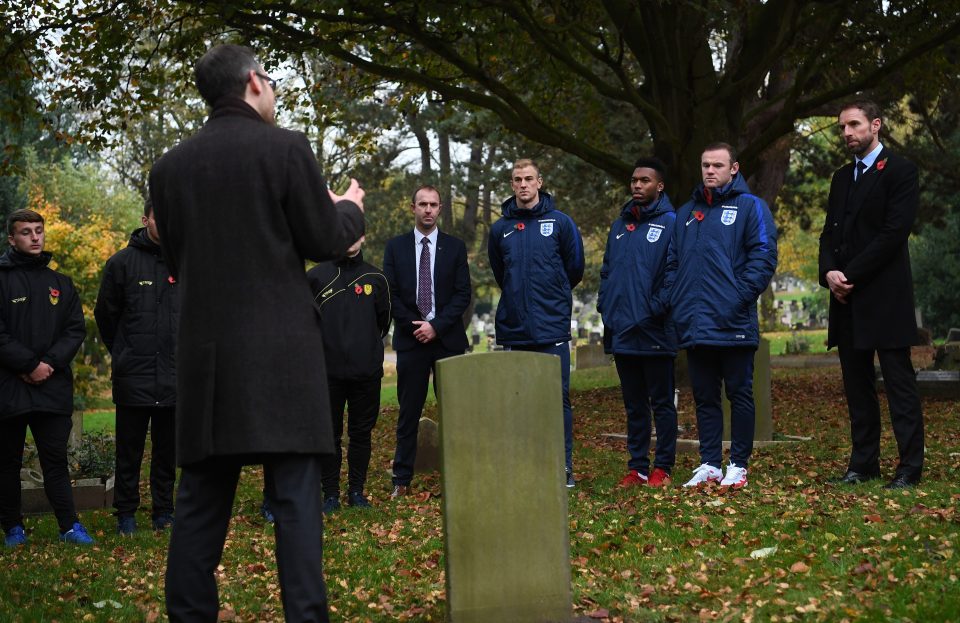 The players and their manager listened to a speech at Stapenhill Cemetery 