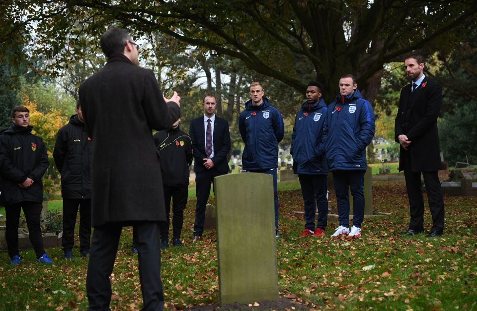 The players listen patiently as they commemorate the dead