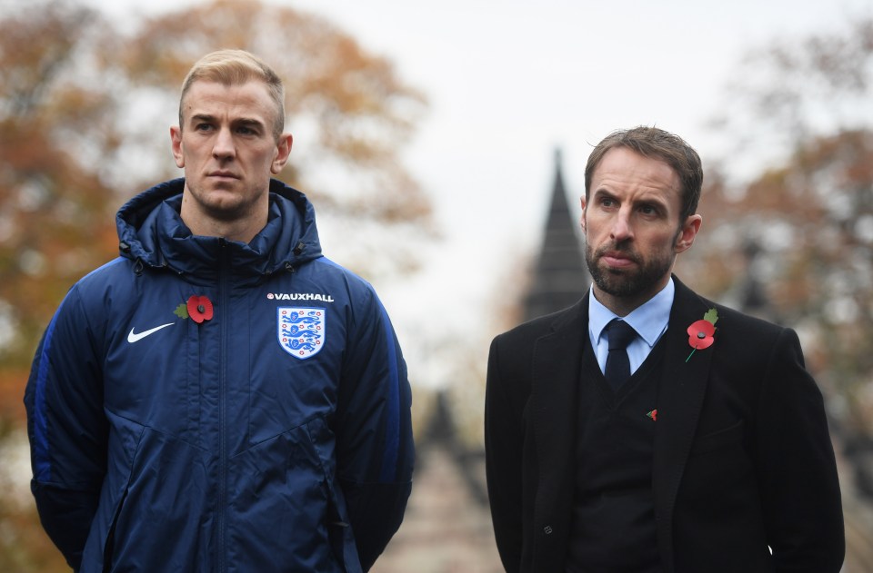 Joe Hart and Gareth Southgate stand proudly with their poppies