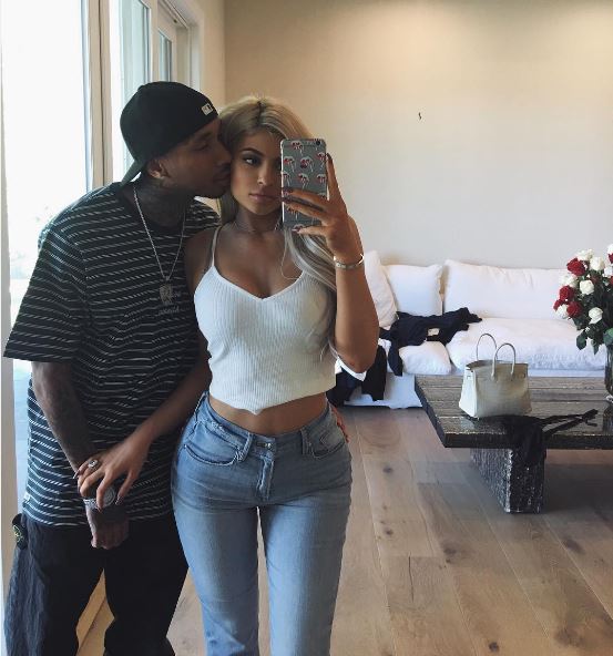 Tyga and Kylie pose for a selfie with the caption 'They don't know'