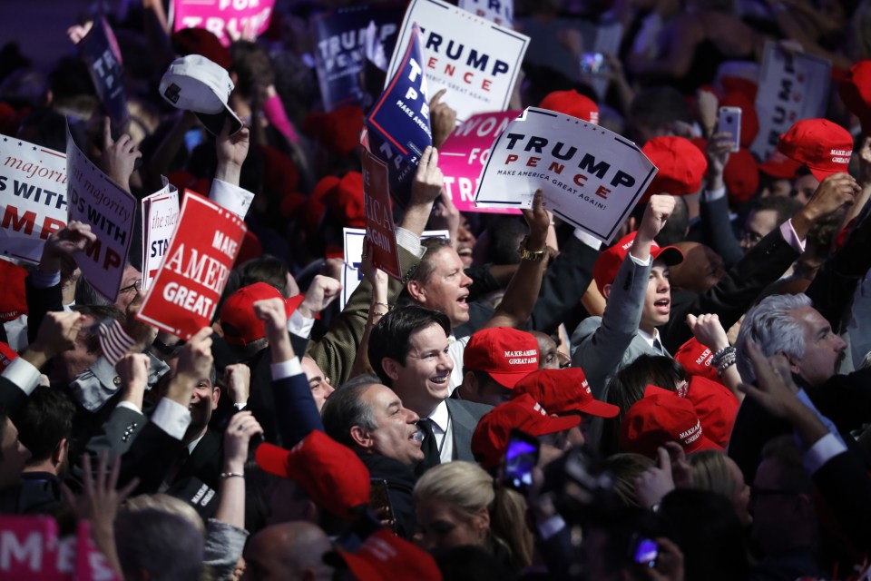 Supporters cheer as they wait for President-elect Donald Trump to give his acceptance speech during his election night rally