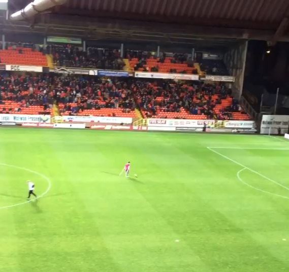  The football fan who has one leg starts at the half-way line and advances towards goal