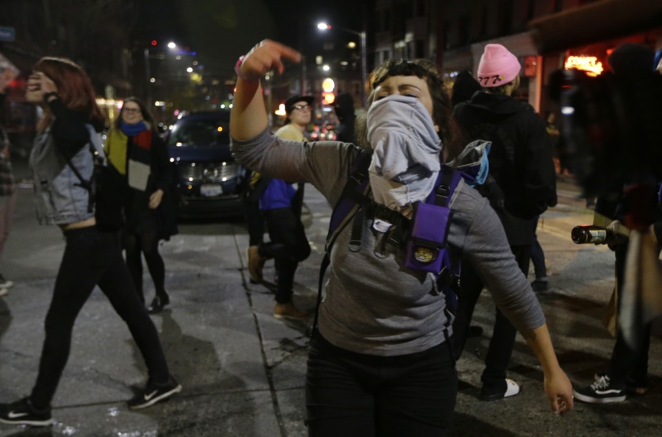  A woman yells as she takes part in a protest against President-elect Donald Trump In Seattle's Capitol Hill neighbourhood