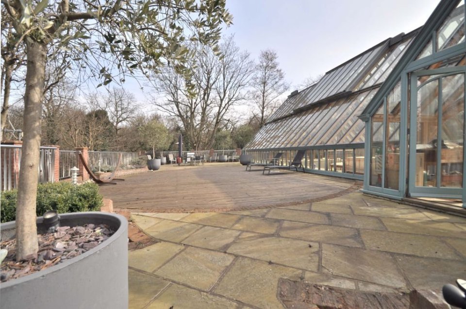  The building now boasts garages and a games room/au pair's suite underneath the lawn