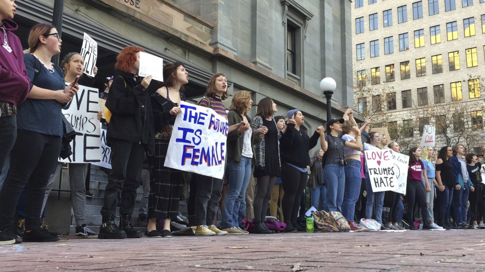  The future is female ... high school students in Portland, Oregon, line the streets to protest Trump's election