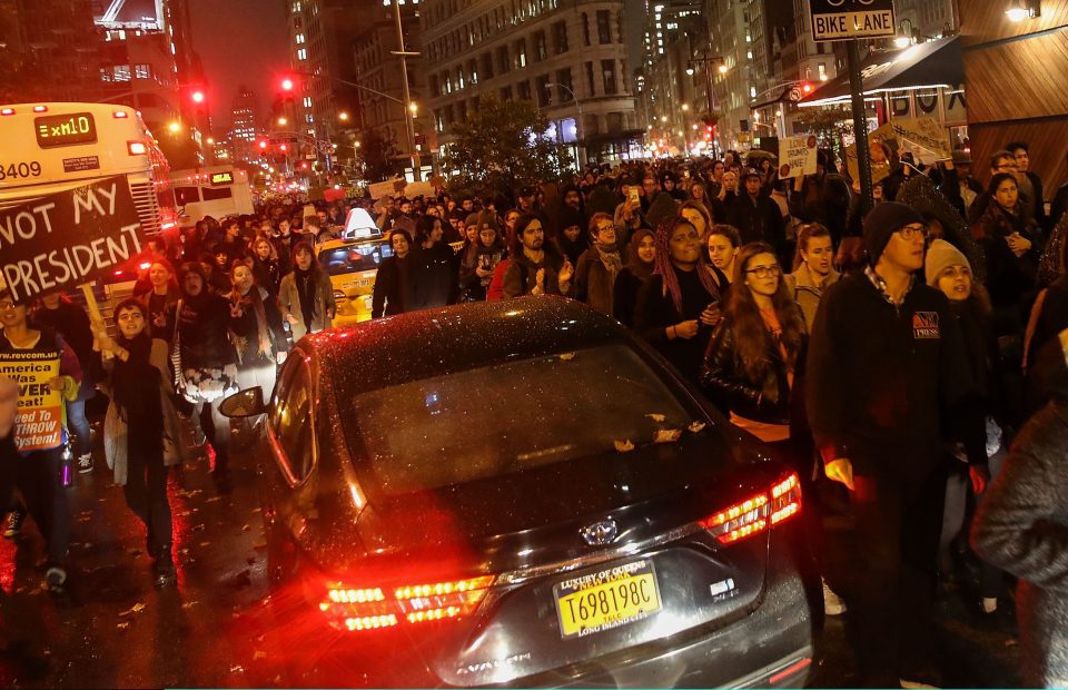  Hundreds of anti-Donald Trump protesters march through traffic on Broadway on their way to Trump Tower