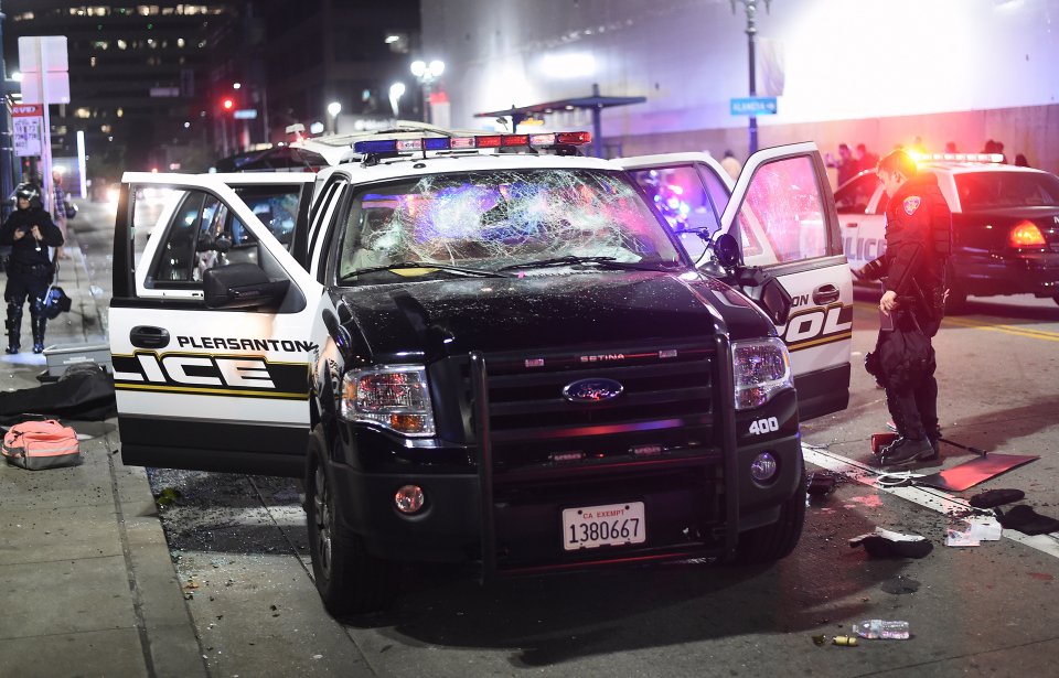  A cop car's window was smashed during the riot in Oakland