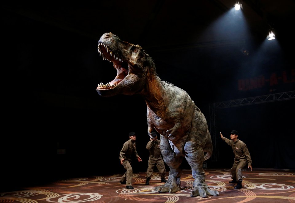 A robotic T-rex performs during its unveiling in Tokyo