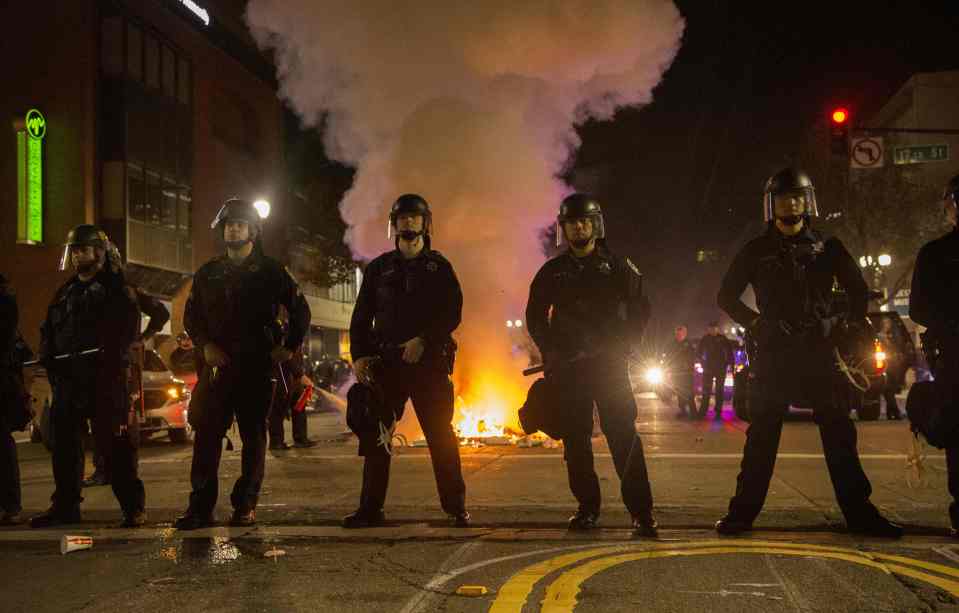  Out in full force ... officers donned gas masks and riot gear to take on the demonstrators