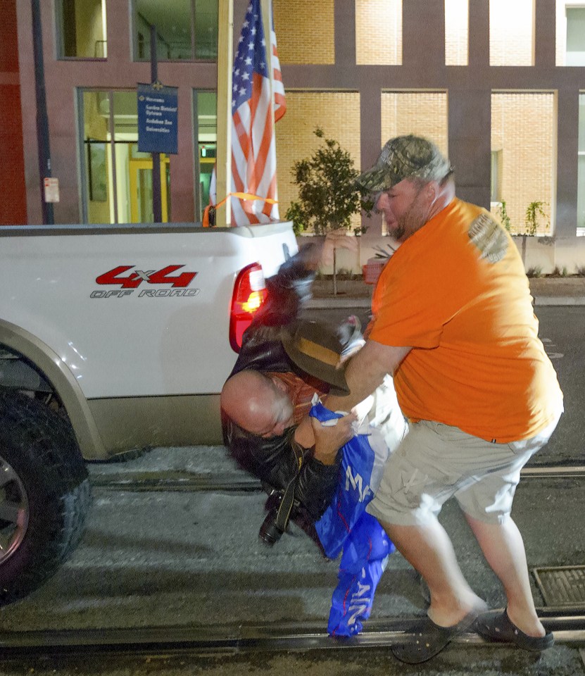  The Trump supporter appeared to throw the man to the ground in the altercation last night