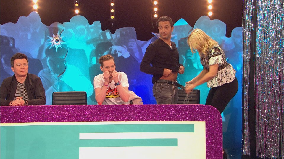  Holly ends up having to unbuckle Gino D'Acampo's belt to follow her piece of string