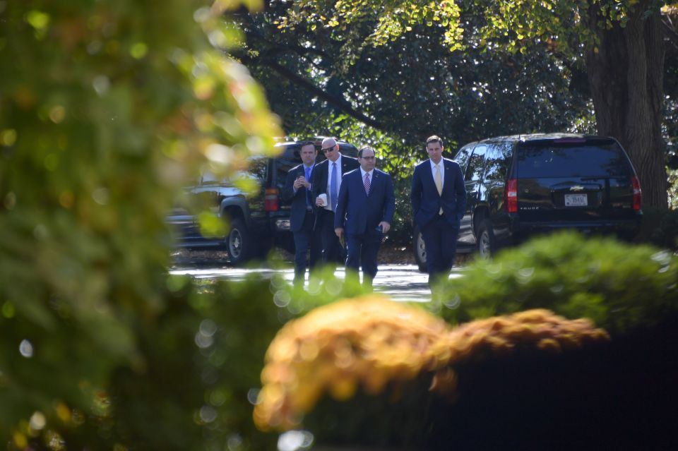  Trump aides including Dan Scavino (left) arrive at the White House