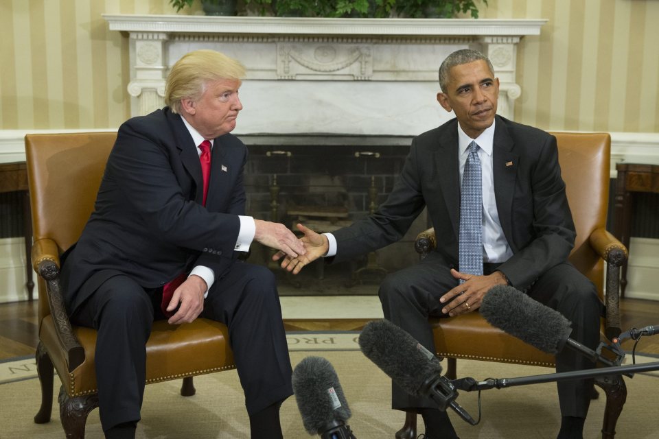  Trump shares a cringe-worthy handshake with President Obama