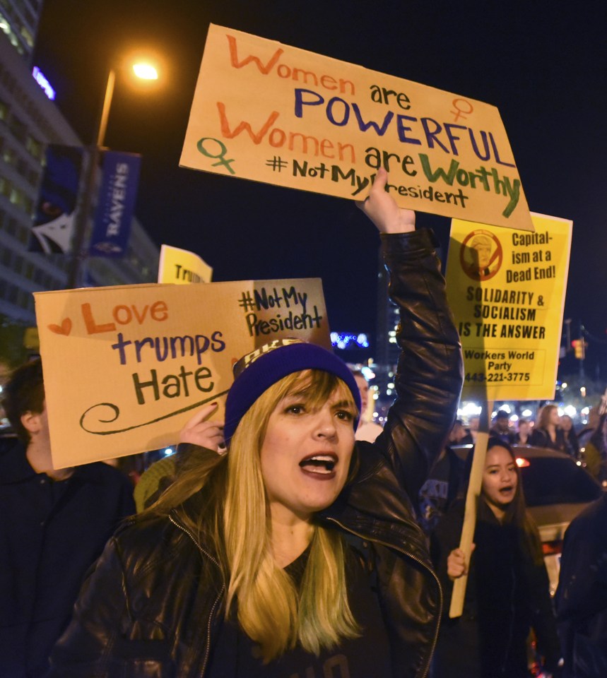  Women are powerful ... anti-Trump protesters march through Baltimore as chaos erupts for second night in a row