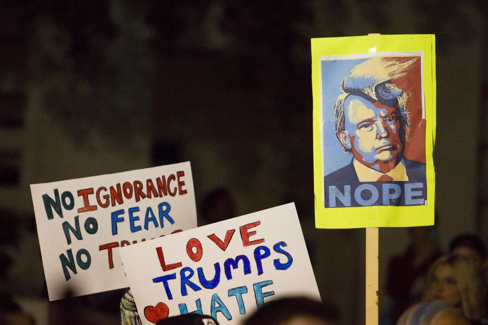  Hundreds of Anti-Trump protesters gather on the historic grassy knoll at Dealey Plaza before marching and closing streets around downtown Dallas